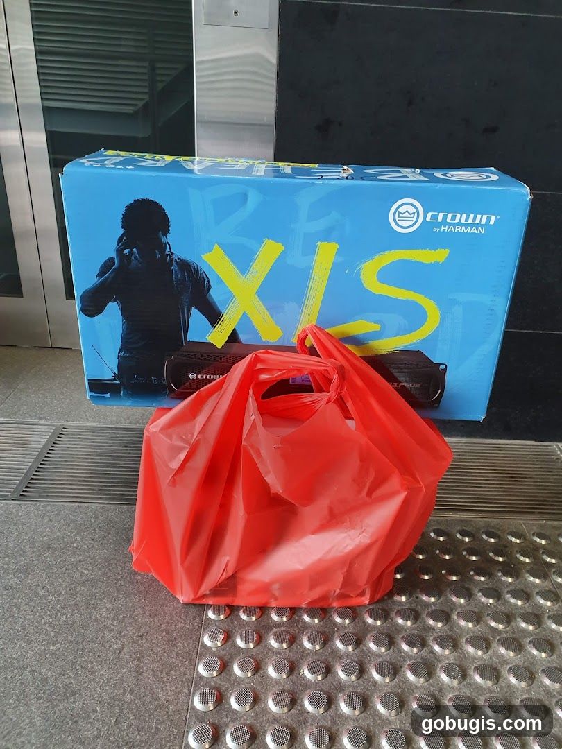 Crown XLS amplifier box and red shopping bag