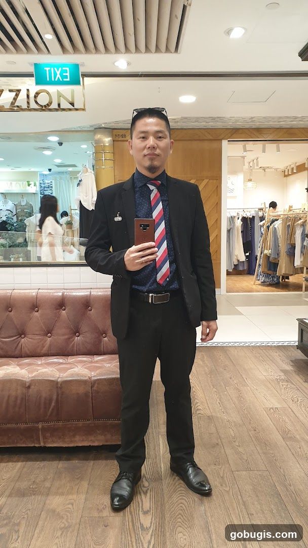Man in Suit Posing in Store