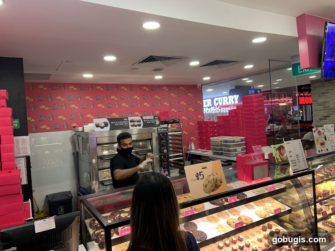 Bakery Counter with Staff and Pastries