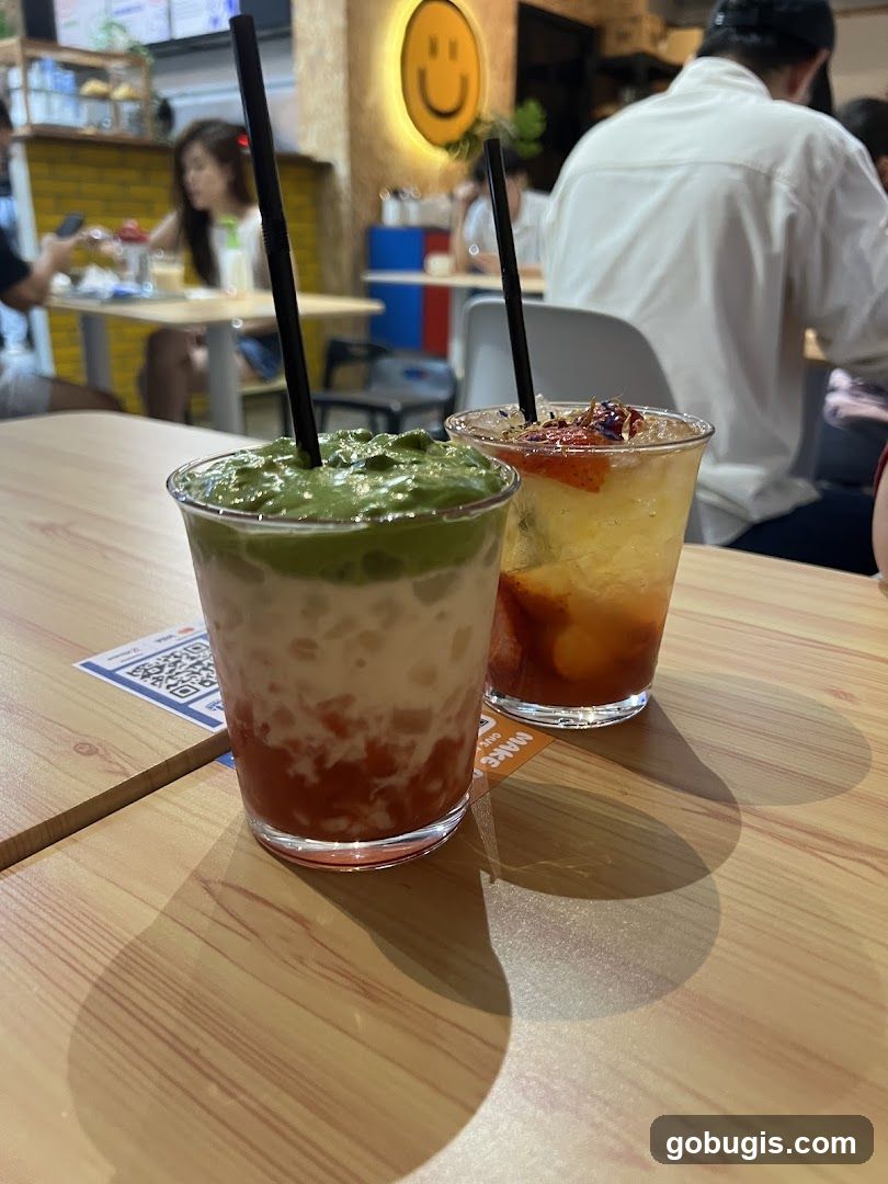 Two colorful drinks on a wooden table