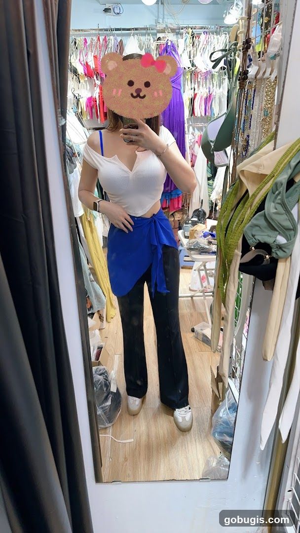 Woman trying on clothes in a boutique