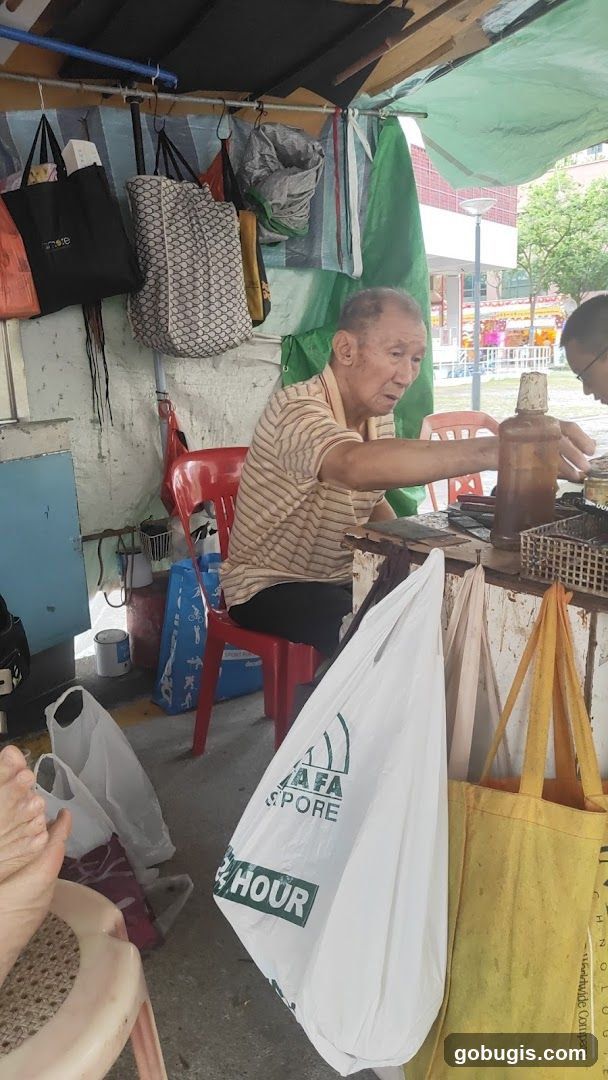 Elderly man at a stall