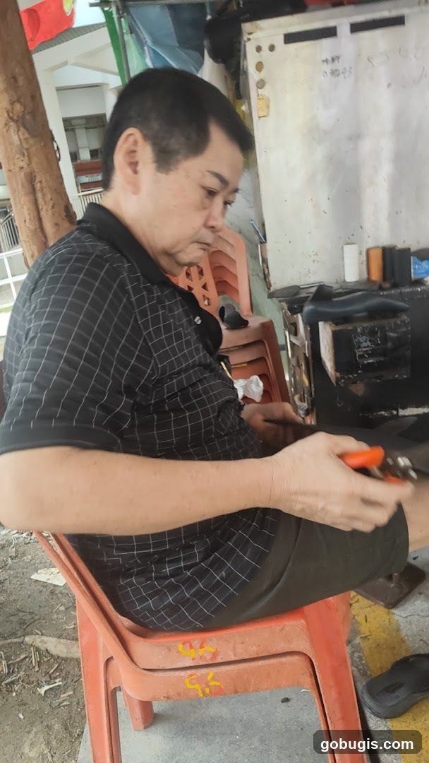 Shoemaker at work