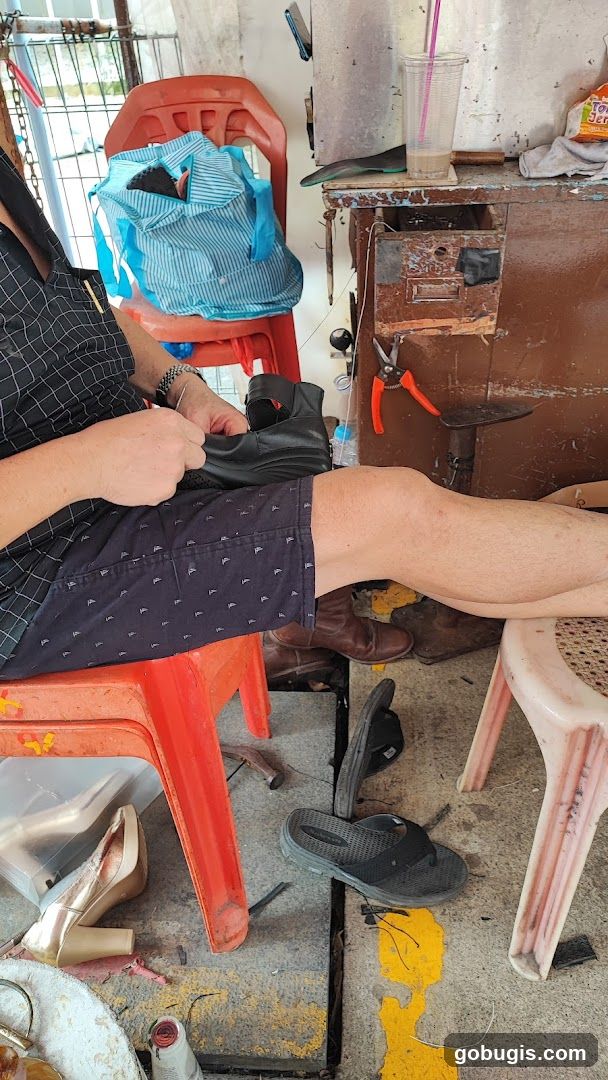 Cobbler working on a shoe