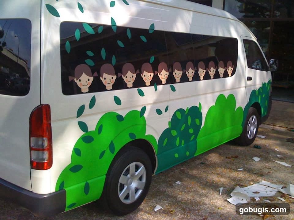 Van with cartoon children and foliage decals