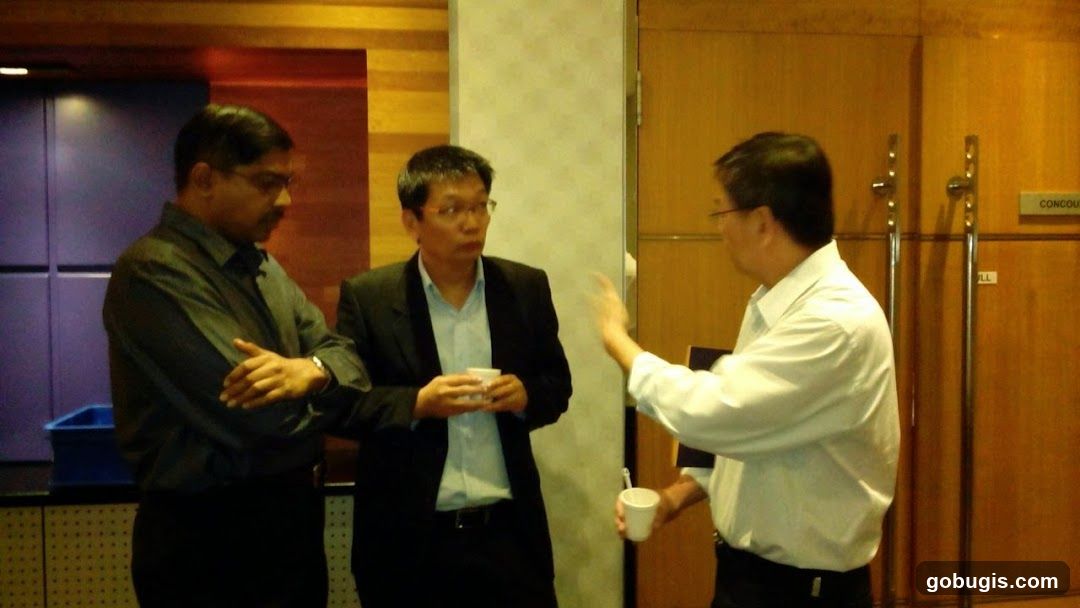 Three men in conversation
