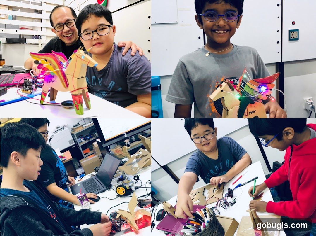 Children building robotic creatures