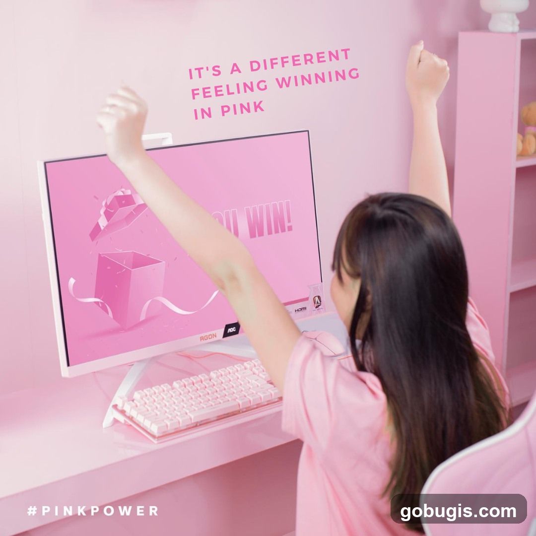 Woman celebrating a win at a pink gaming setup