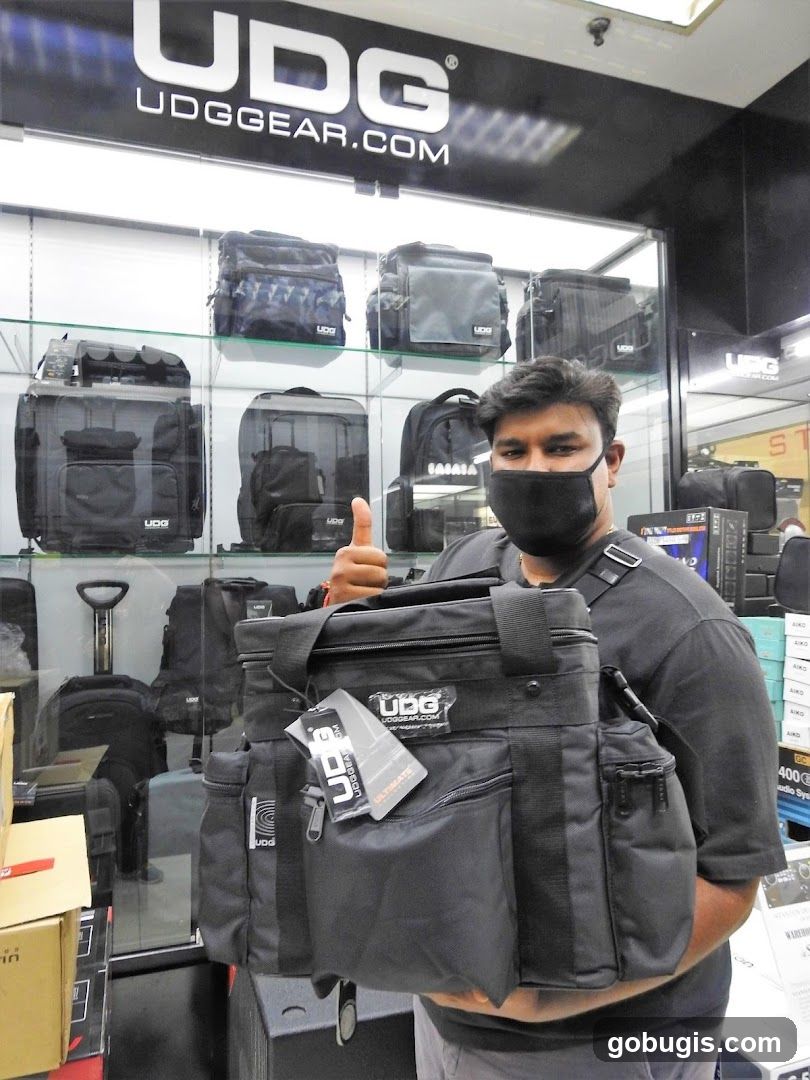 Man holding a UDG bag