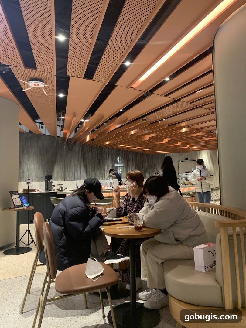 People sitting at tables in a cafe