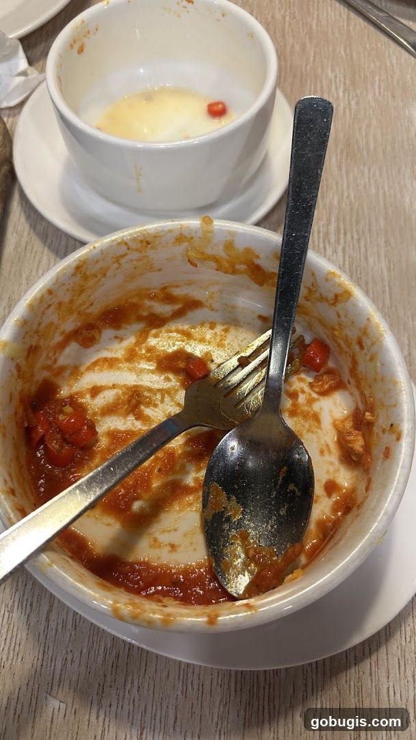 Dirty Bowls with Utensils