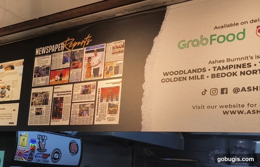 Newspaper Clippings and GrabFood Advertisement