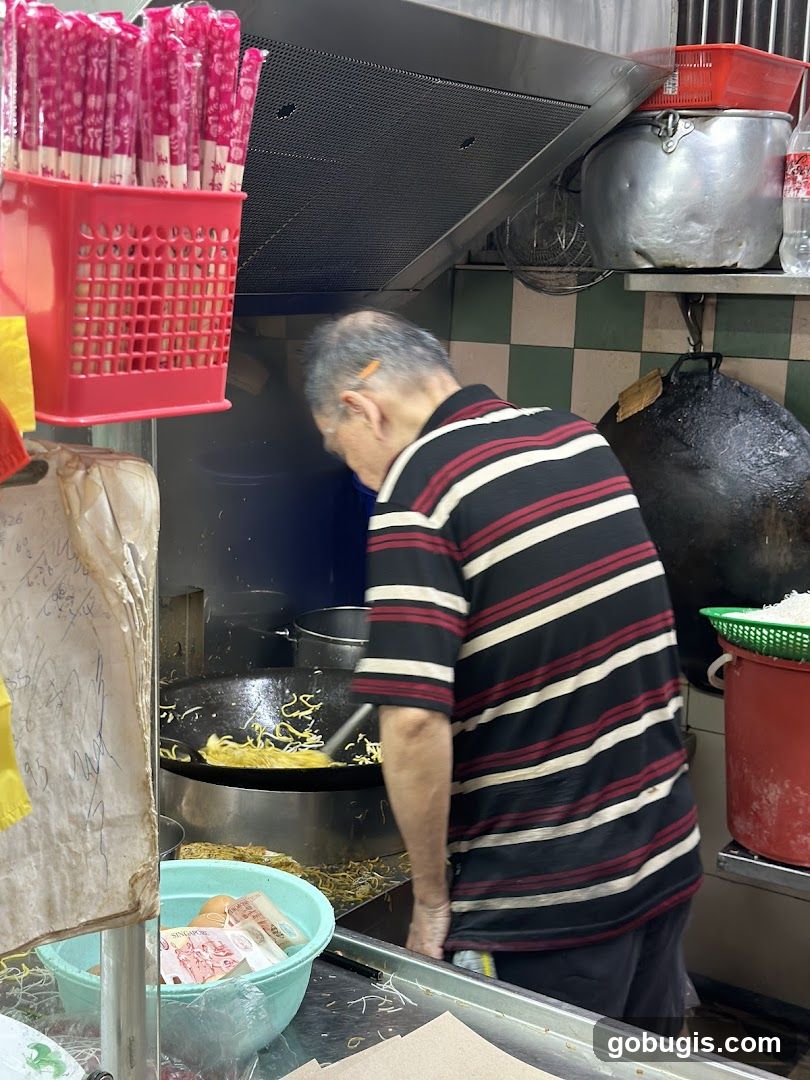 Cook preparing noodles