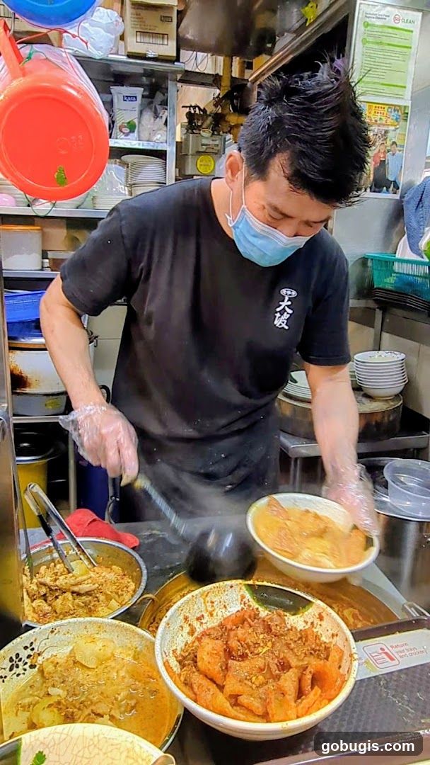 Food Stall Vendor Preparing Meal