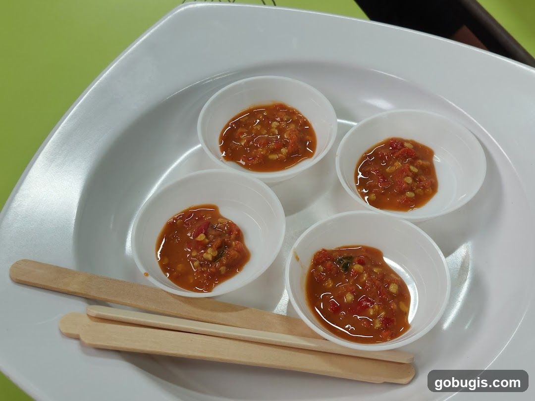 Four small bowls of chili sauce