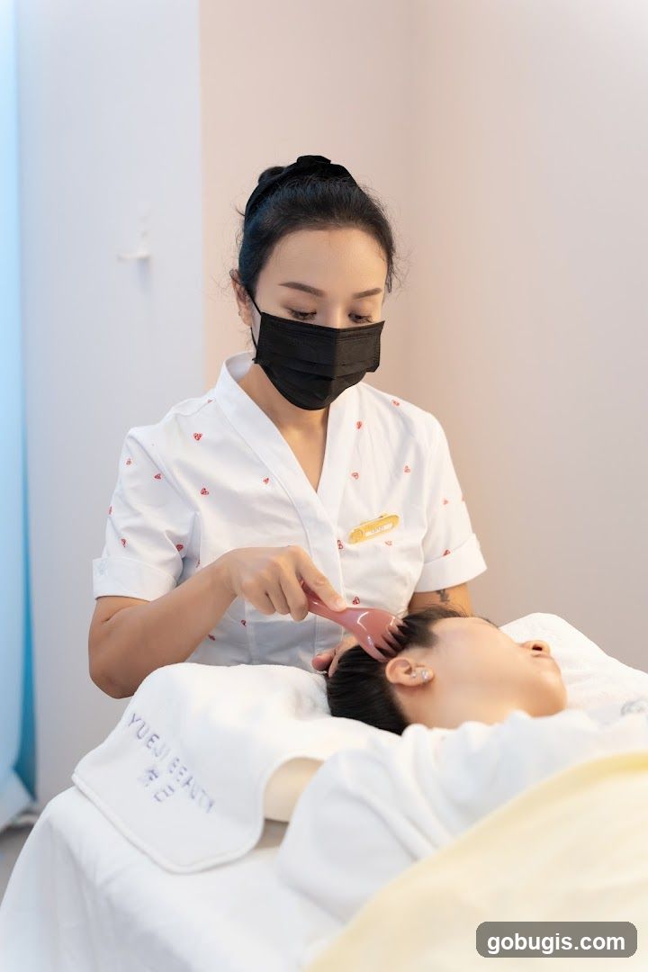 Beautician performing a scalp massage