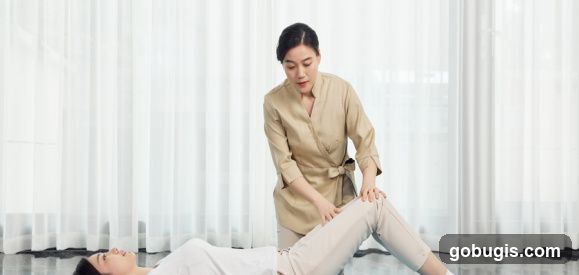 Therapist assisting patient