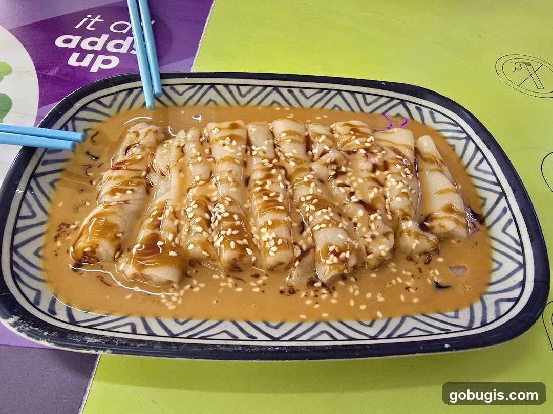 Rolled Rice Noodles with Sauce and Sesame Seeds