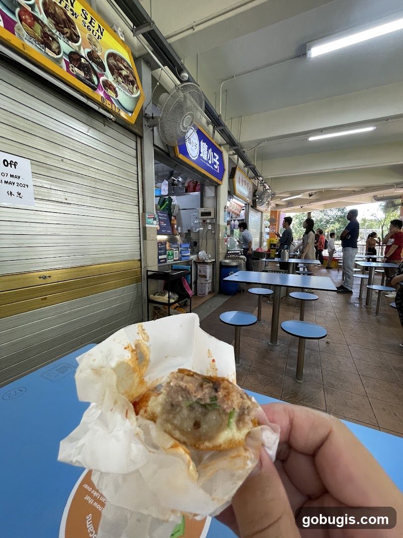 Food stall with a person holding food
