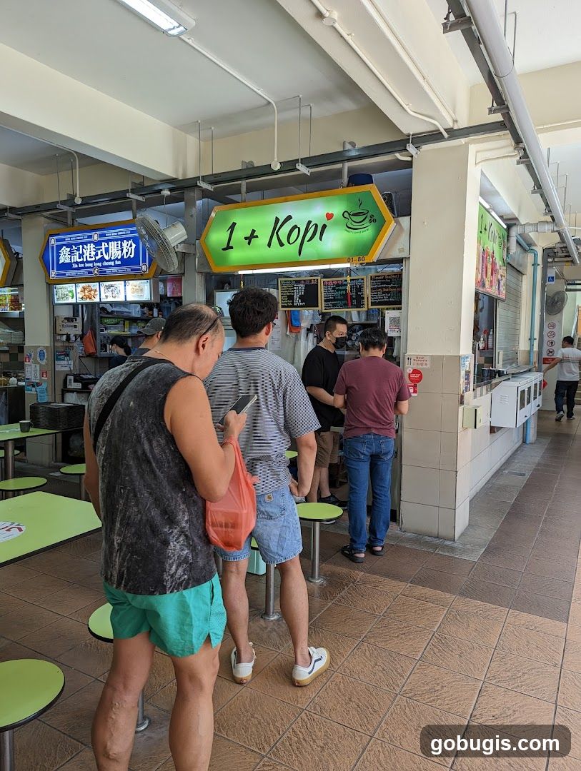 People queuing at a food stall