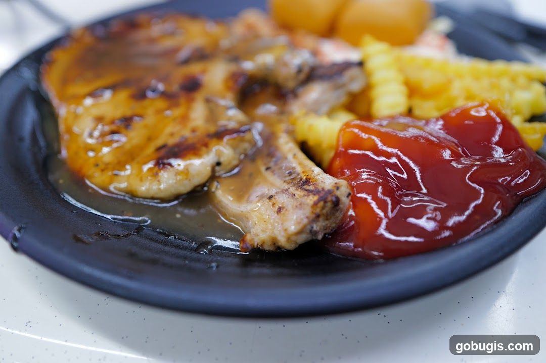 Pork Chop with Fries and Ketchup