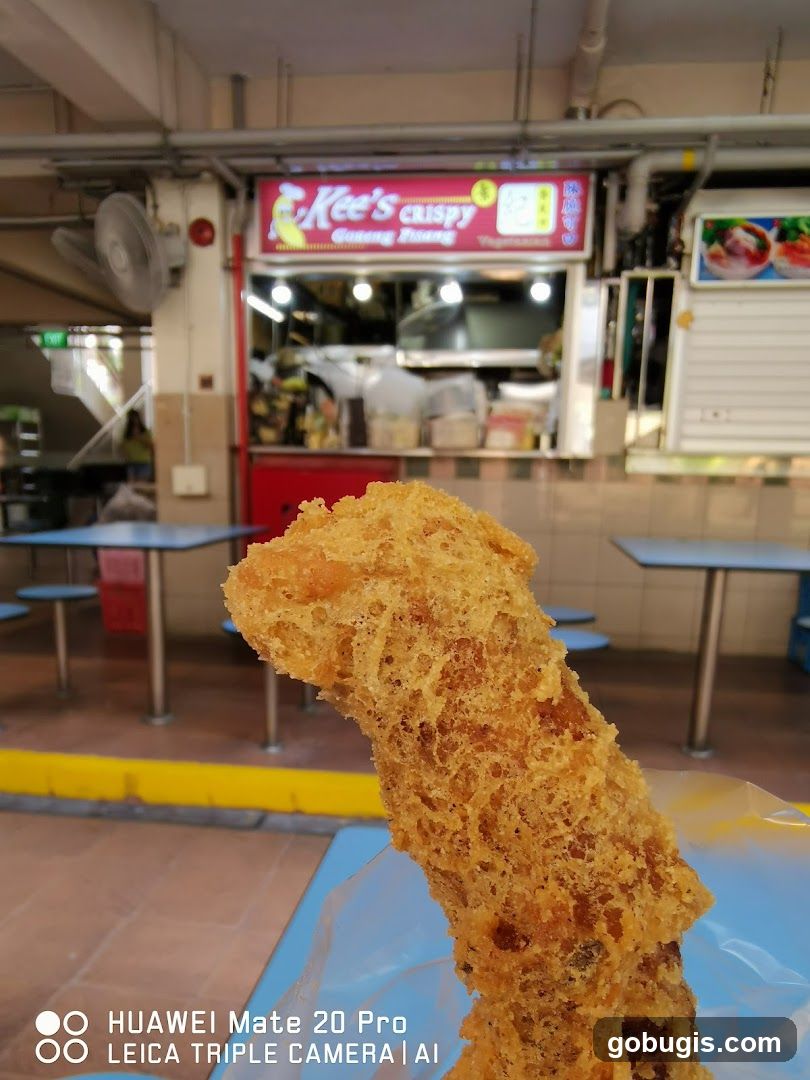 Fried Food Item in Front of a Stall