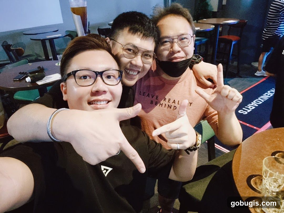Friends posing for a photo in a bar