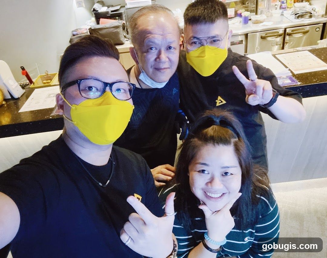 Four people posing for a selfie