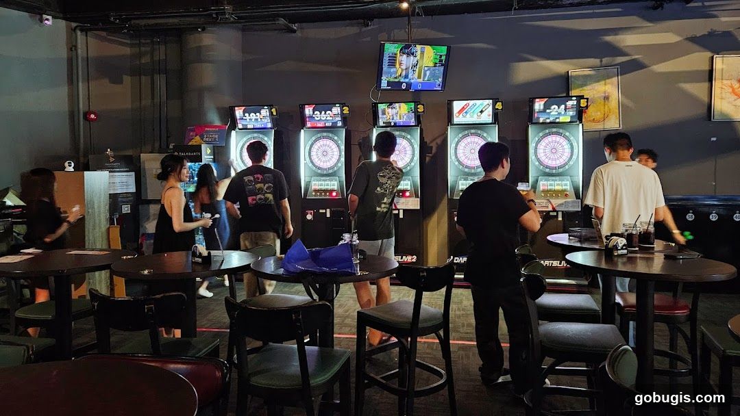 People playing darts in a bar