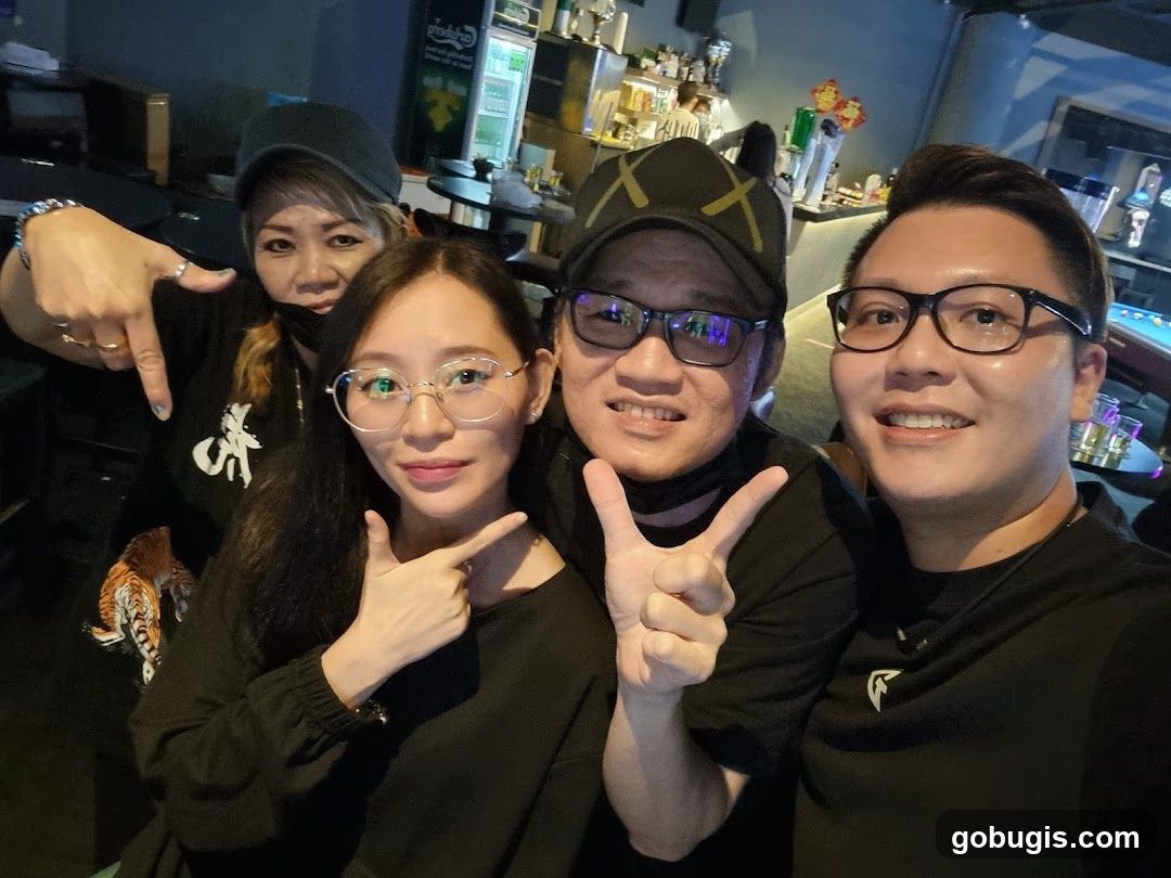 Group posing for a photo in a bar
