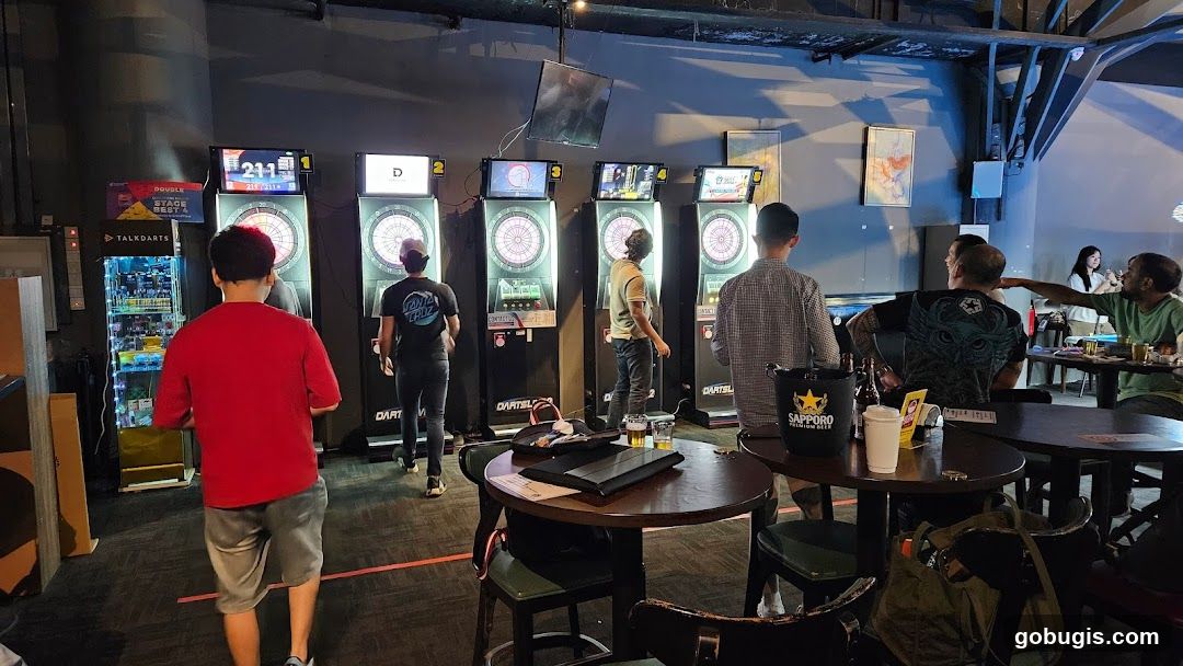 People playing darts in a bar