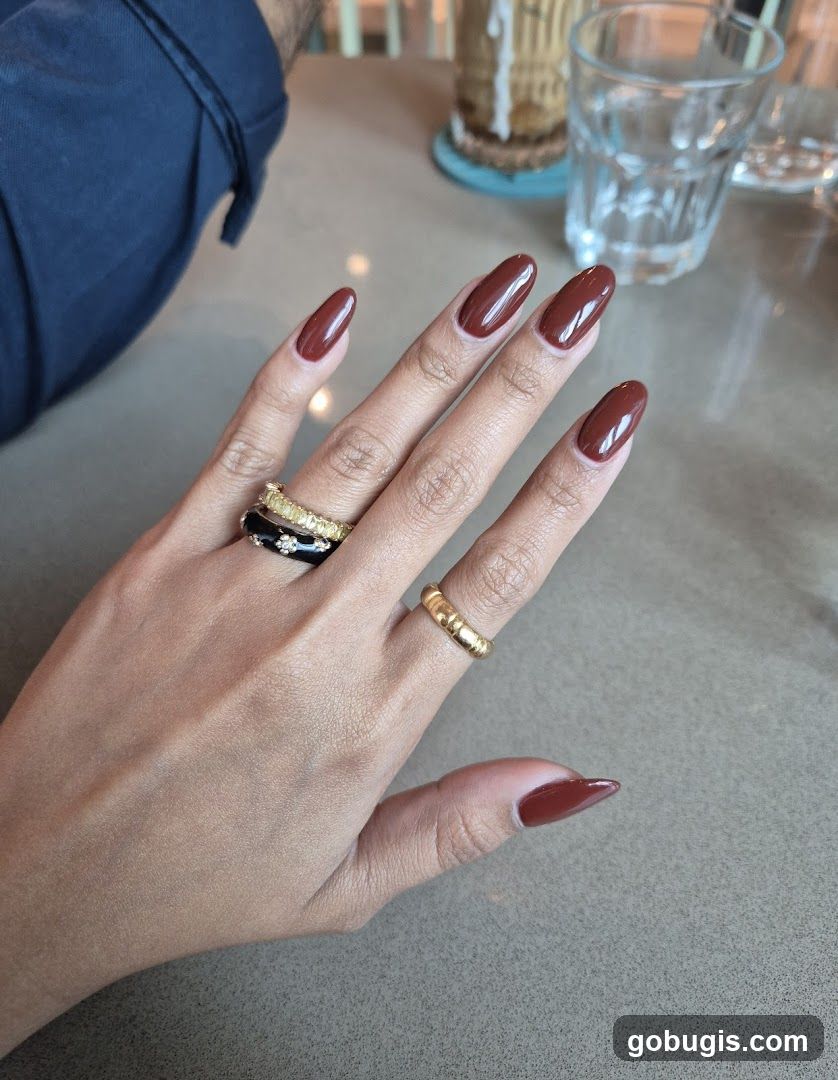 Woman's hand with polished nails and rings
