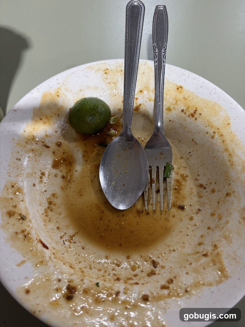Dirty Plate with Lime and Utensils