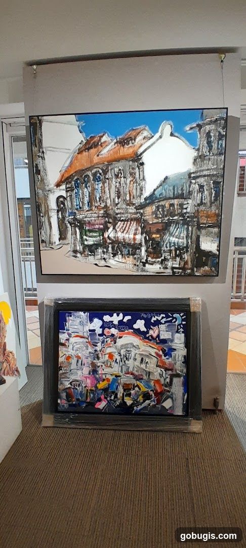 Two paintings of street scenes