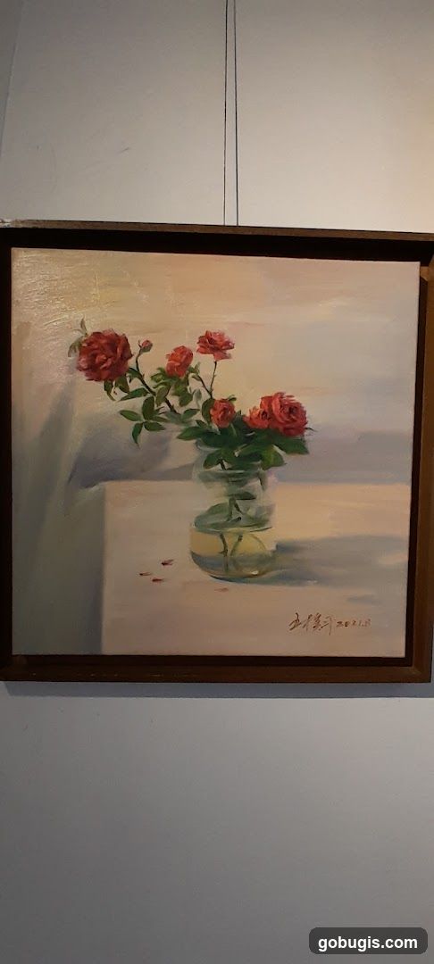 Oil painting of roses in a vase