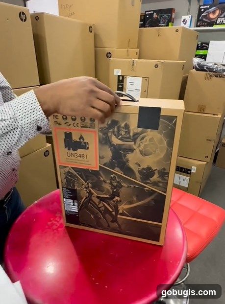 Person opening a box with game art