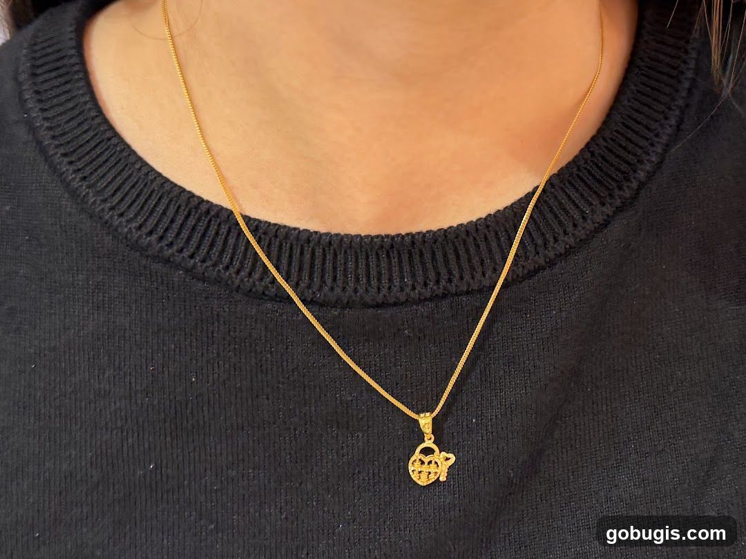 Gold Necklace with Lock and Key Pendant