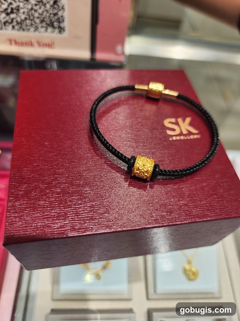 Gold bracelet on a red box