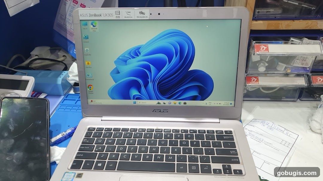 Laptop and phone on a desk