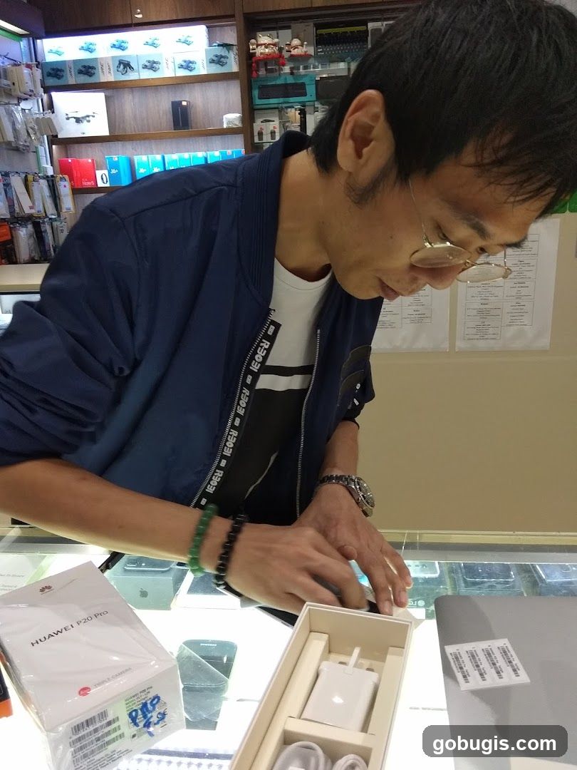 Man examining electronics in a store
