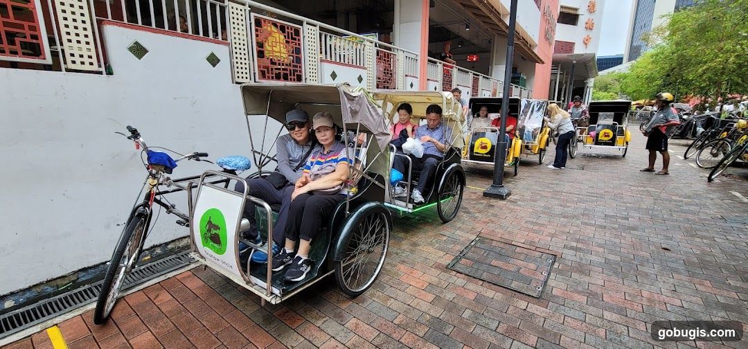 Pedicabs Lined Up on Cobblestone Street