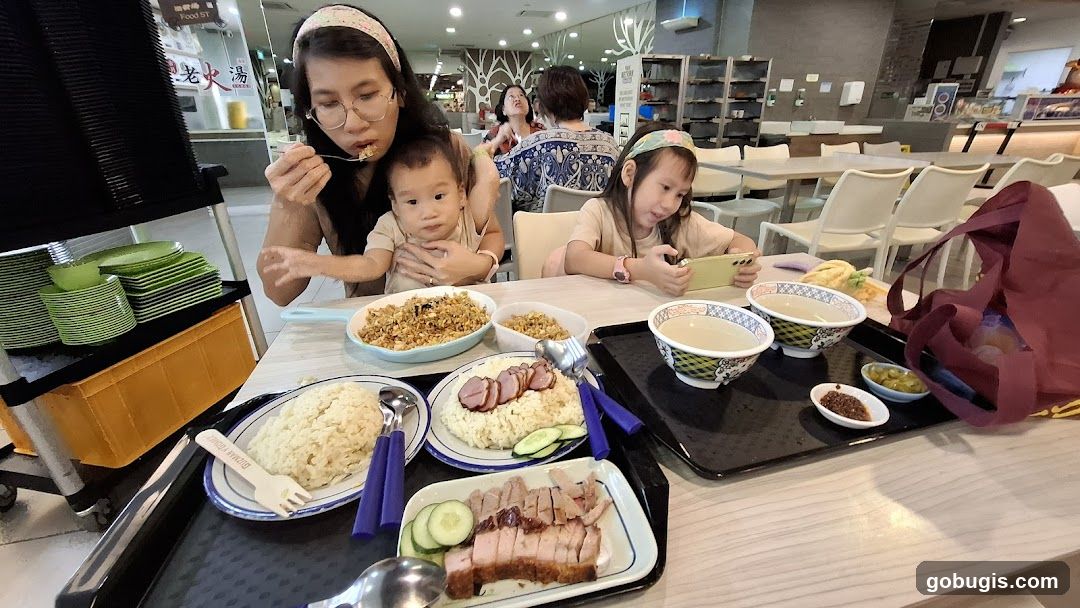 Family enjoying a meal at a food court