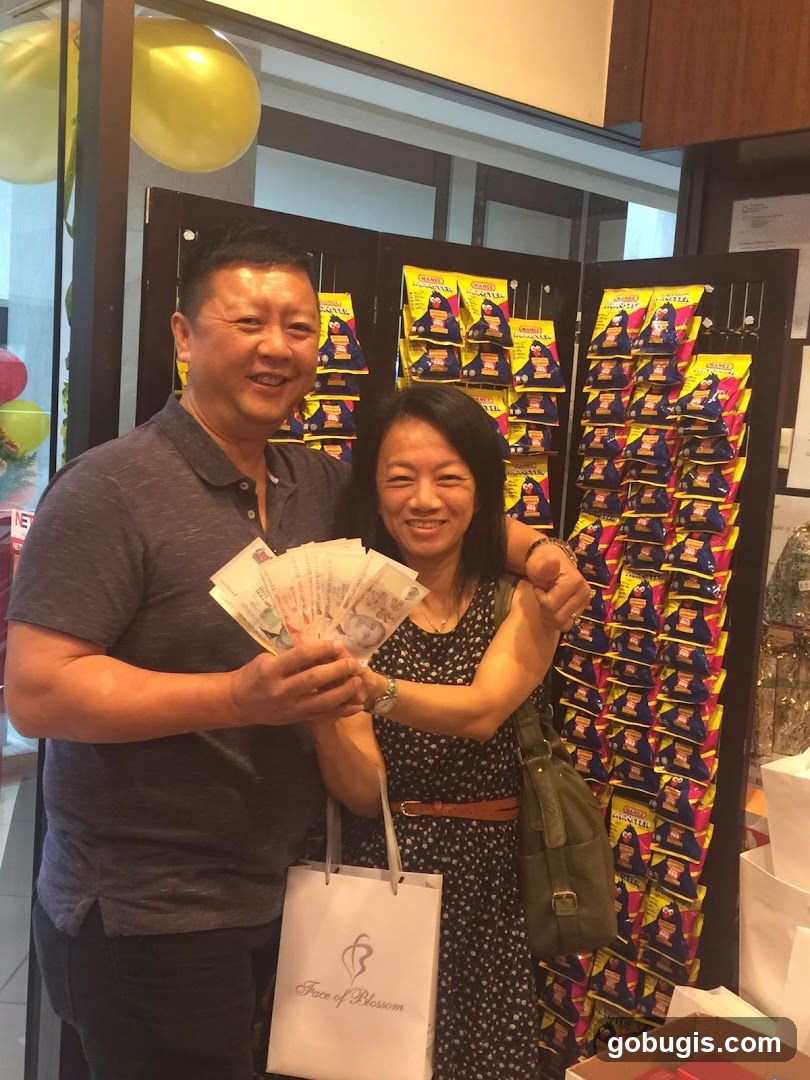 Couple holding money and shopping bags