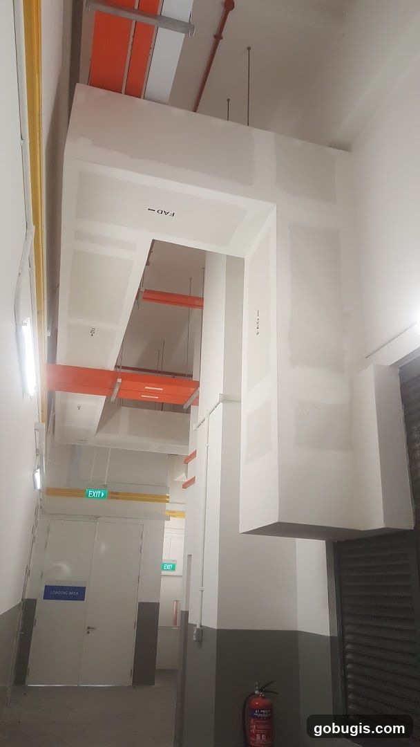 Interior of a building with exposed conduits and ductwork