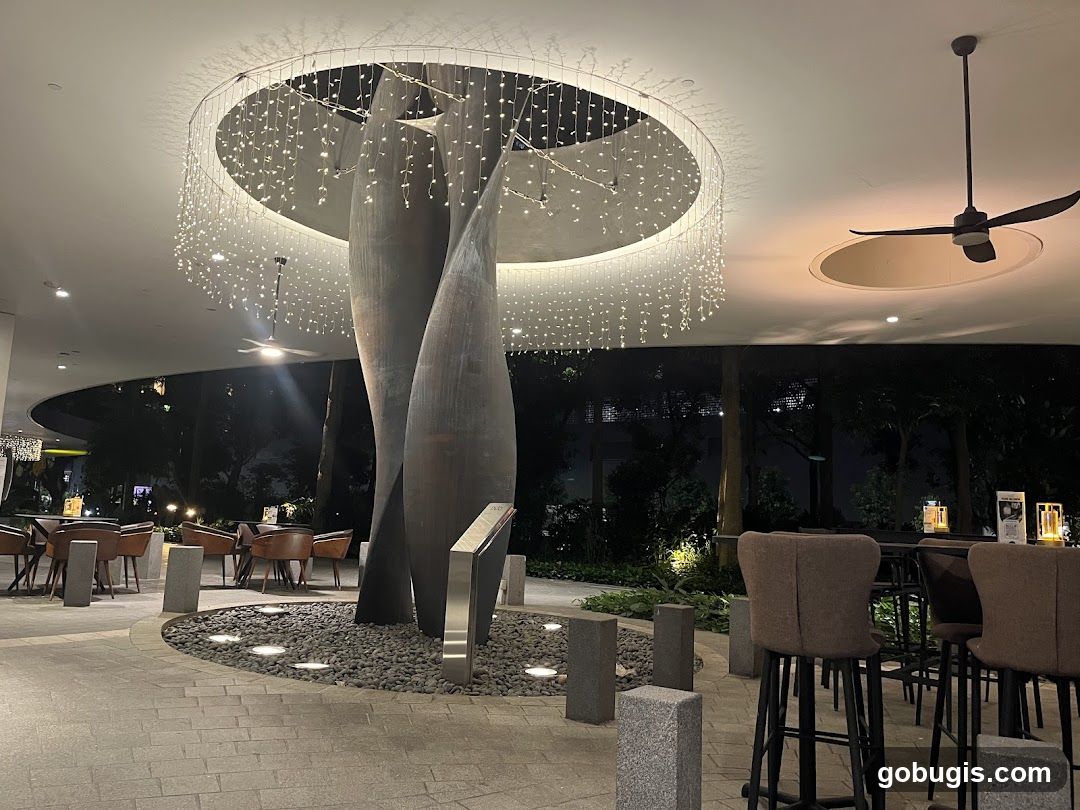 Outdoor Seating Area with Modern Sculpture and Lighting