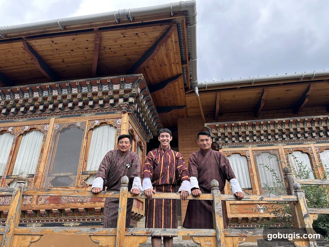 Three men in traditional Bhutanese attire