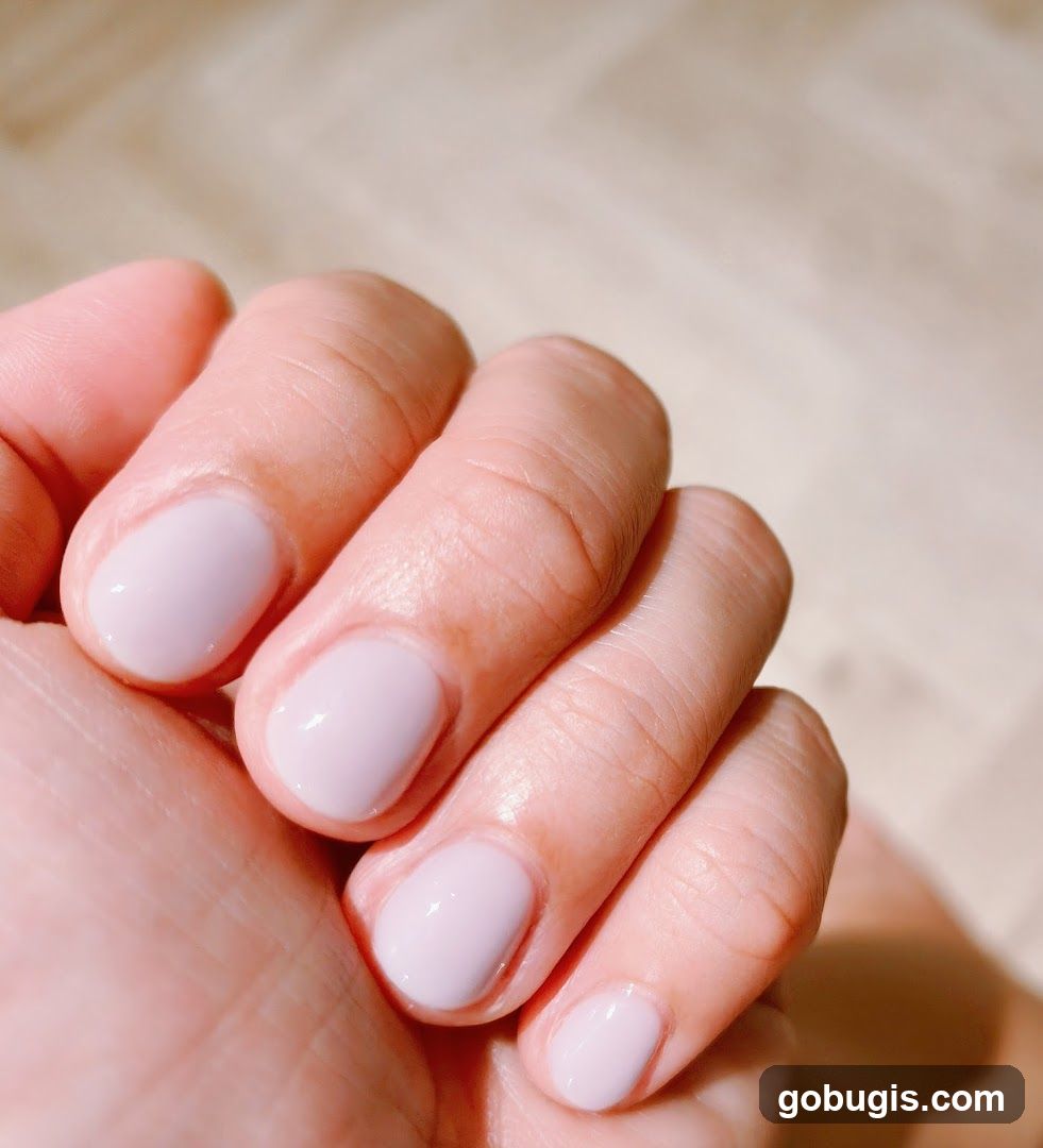Manicured Hand with Light Pink Nails