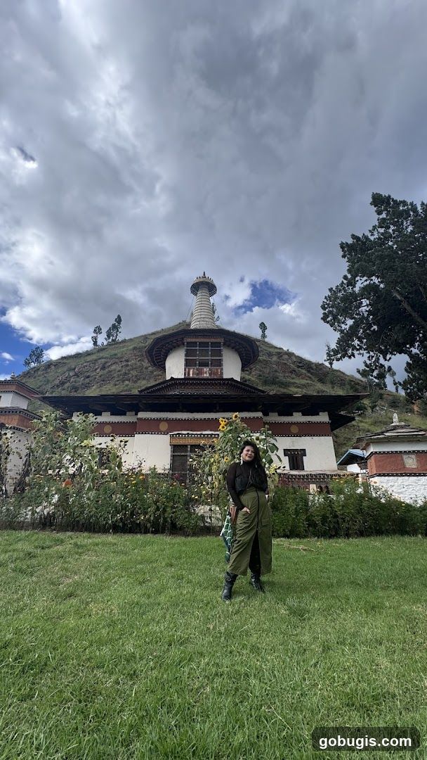 Woman Poses in Front of a Stupa