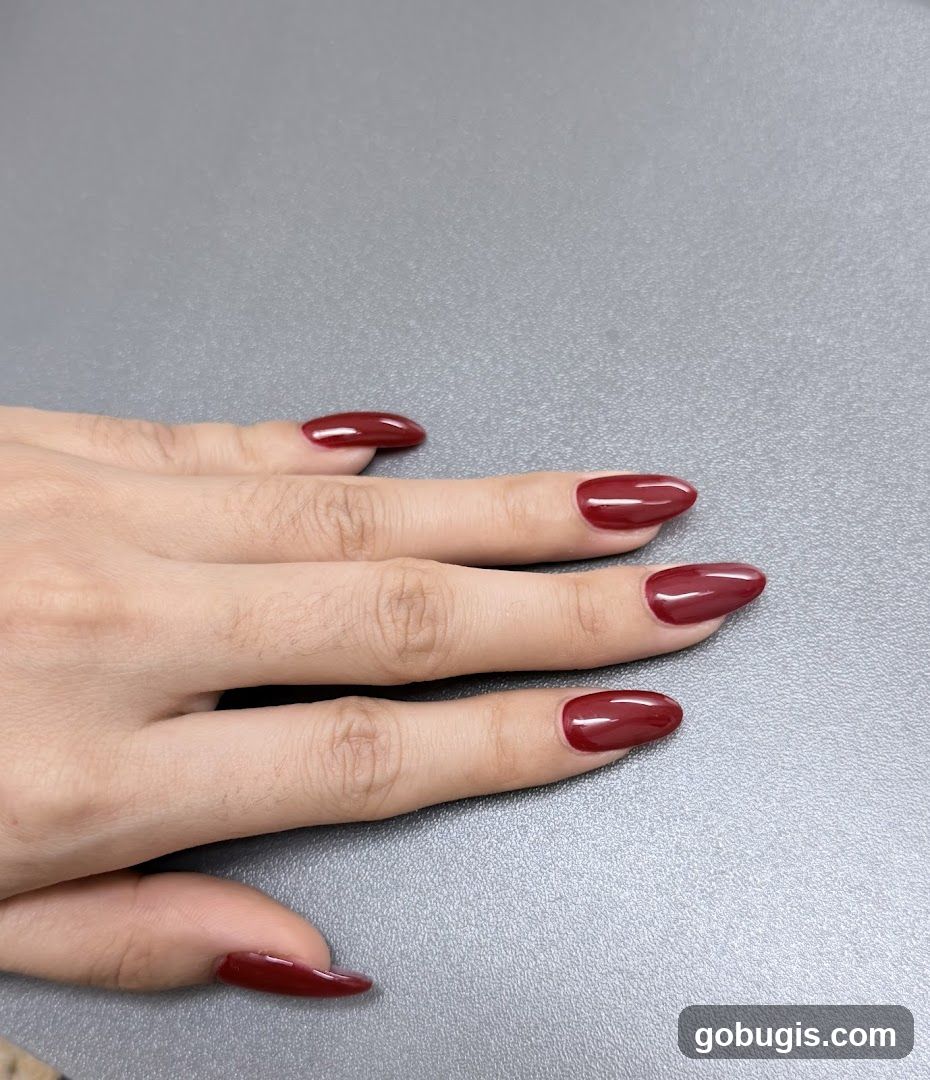 Hand with Burgundy Nails