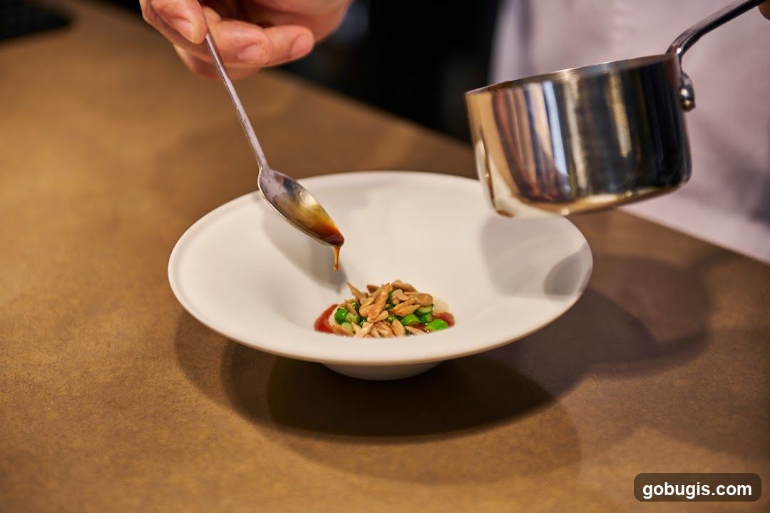 Chef garnishing a dish